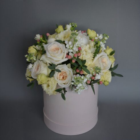 Luxury white and ivory rose flower box with lisianthus and delicate greenery in a blush pink hat box, elegant pastel floral arrangement, Toronto flower delivery