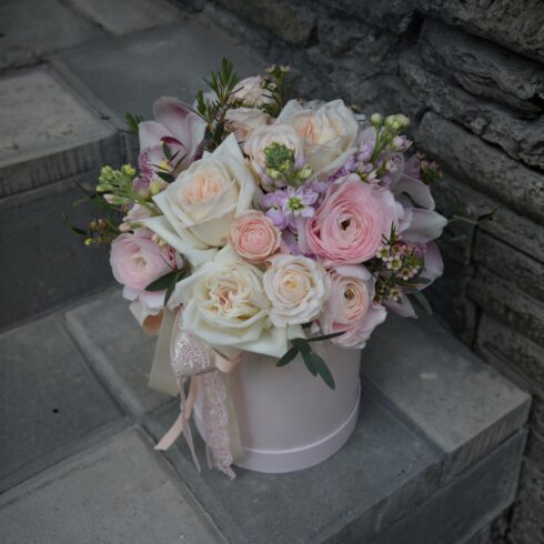 Luxury blush and ivory rose flower box with ranunculus and delicate pastel flowers in a blush pink hat box with ribbon, romantic floral arrangement, Toronto flower delivery