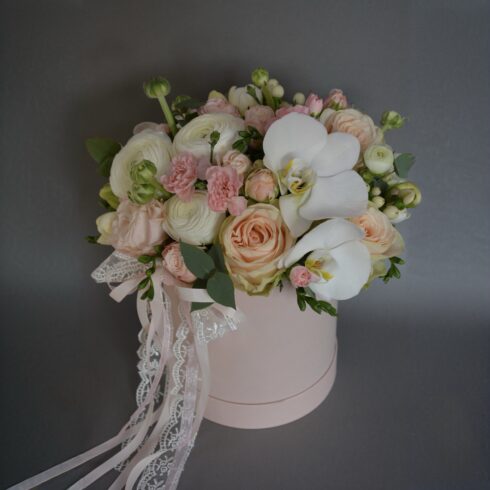 Luxury orchid, rose and ranunculus flower box with white Phalaenopsis orchids, peach roses and soft blush flowers in a pink hat box, Toronto and GTA flower delivery