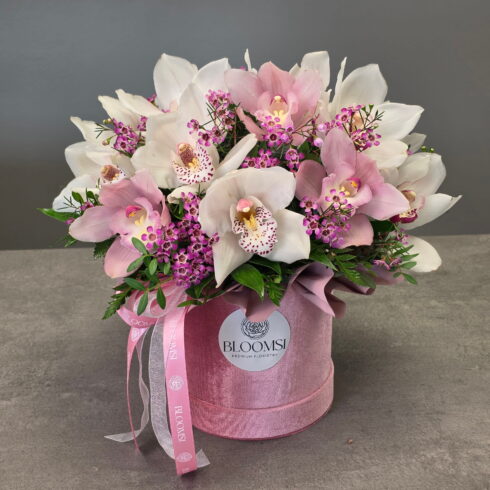 Luxury white and pink orchid flower box in a blush pink hat box, premium orchid arrangement with greenery, Toronto flower delivery