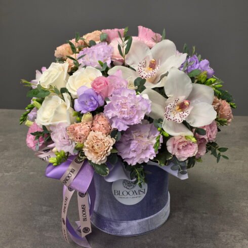 Purple and pink luxury flower box with orchids, roses and lisianthus by BLOOMSI Toronto GTA