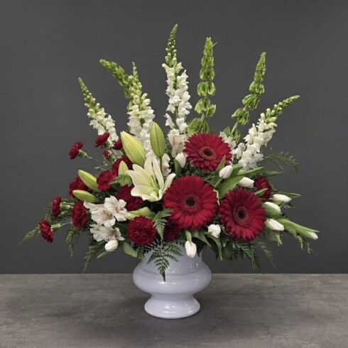 Crimson Grace Traditional Tribute Arrangement with red gerberas and white lilies in Oakville