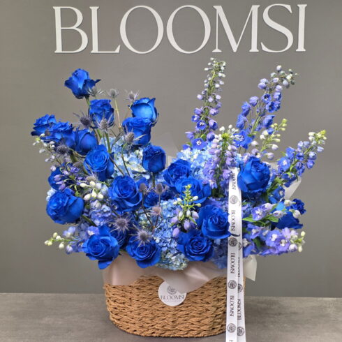 Royal Sapphire Luxury Flower Basket with blue roses and hydrangeas by BLOOMSI