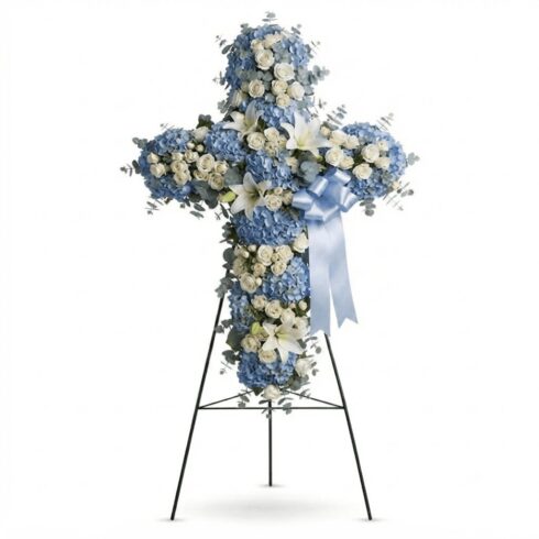 Luxury blue and white funeral cross with hydrangeas white roses lilies and eucalyptus by Bloomsi