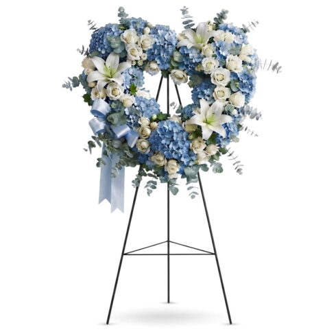 Luxury blue and white heart wreath with hydrangeas white roses lilies and eucalyptus by Bloomsi