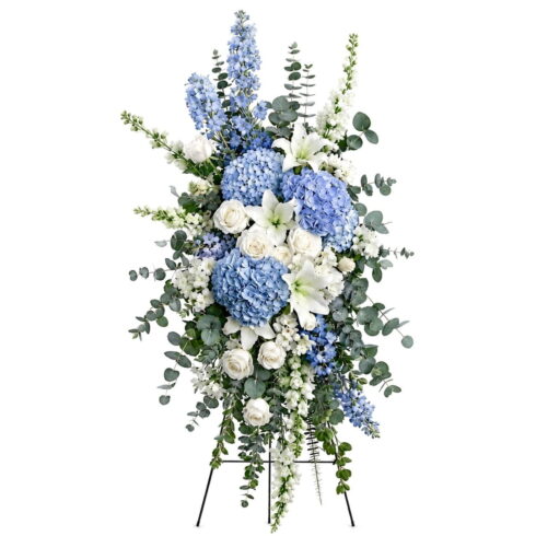 Luxury blue and white standing spray with hydrangeas lilies roses and eucalyptus by Bloomsi