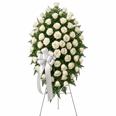 Luxury white rose standing spray with premium roses greenery and white ribbon by Bloomsi