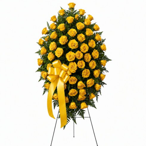 Luxury yellow rose standing spray with premium roses greenery and yellow ribbon by Bloomsi