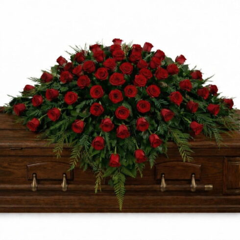 Red Rose Casket Spray with premium roses and greenery by Bloomsi