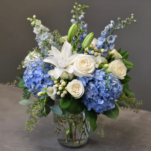 Close-up of Blue Hydrangea Luxury Vase Arrangement with white roses and lilies in Oakville & Mississauga